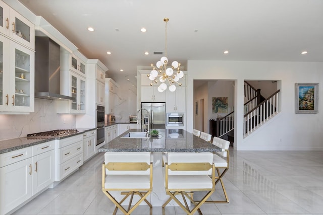 8451 Grand Prix Ln, Boynton Beach, FL 33472 - kitchen with wall chimney range hood, a center island with sink, recessed lighting, and appliances with stainless steel finishes