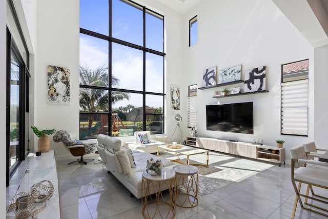 8451 Grand Prix Ln, Boynton Beach, FL 33472 - tiled living area featuring a towering ceiling