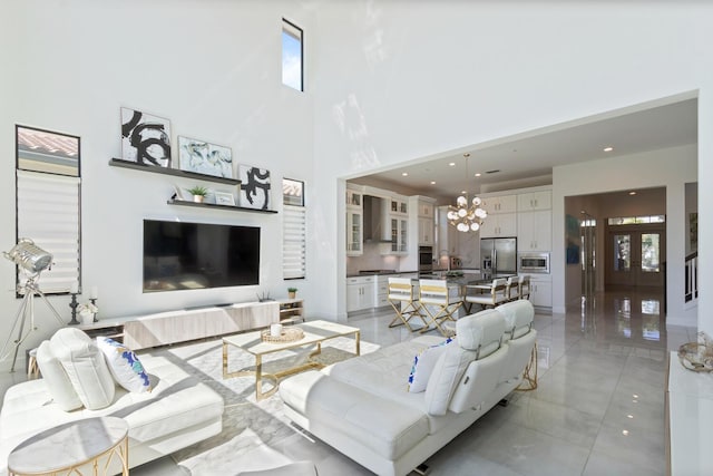 8451 Grand Prix Ln, Boynton Beach, FL 33472 - living room with an inviting chandelier, a healthy amount of sunlight, a high ceiling, and recessed lighting