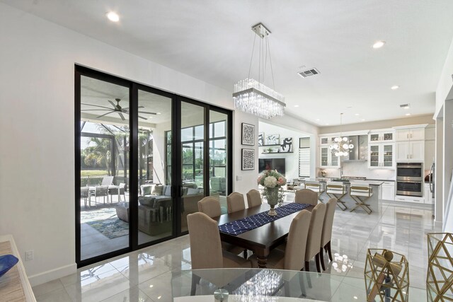 8451 Grand Prix Ln, Boynton Beach, FL 33472 - dining space featuring baseboards, visible vents, recessed lighting, and ceiling fan with notable chandelier