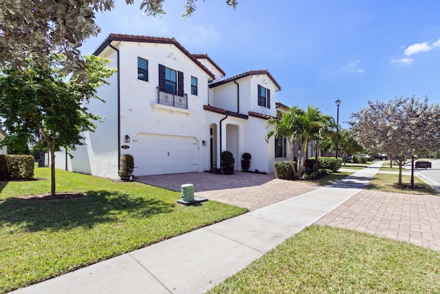 8451 Grand Prix Ln, Boynton Beach, FL 33472 - mediterranean / spanish house featuring stucco siding, an attached garage, a tiled roof, driveway, and a front yard