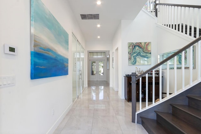 8451 Grand Prix Ln, Boynton Beach, FL 33472 - hallway featuring french doors, baseboards, stairway, and visible vents