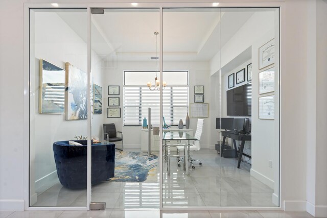 8451 Grand Prix Ln, Boynton Beach, FL 33472 - tiled home office featuring baseboards, a notable chandelier, and a raised ceiling