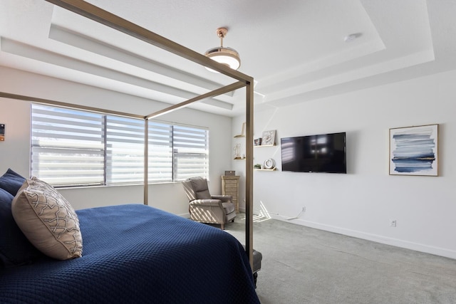 8451 Grand Prix Ln, Boynton Beach, FL 33472 - carpeted bedroom featuring baseboards and a tray ceiling