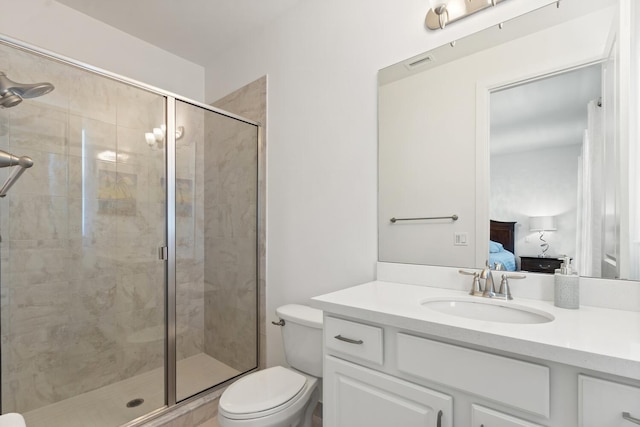 8451 Grand Prix Ln, Boynton Beach, FL 33472 - bathroom with a stall shower, toilet, vanity, and ensuite bathroom