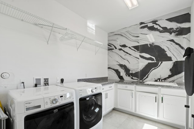 8451 Grand Prix Ln, Boynton Beach, FL 33472 - washroom with washing machine and clothes dryer, cabinet space, and a sink