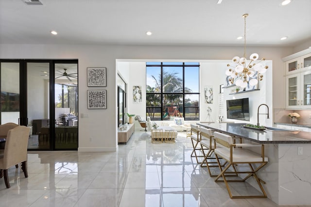 8451 Grand Prix Ln, Boynton Beach, FL 33472 - dining room featuring a wealth of natural light and recessed lighting