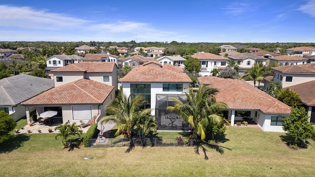 8451 Grand Prix Ln, Boynton Beach, FL 33472 - exterior space featuring stucco siding, a tiled roof, a lanai, and a residential view