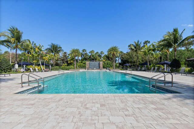 8451 Grand Prix Ln, Boynton Beach, FL 33472 - community pool with a patio