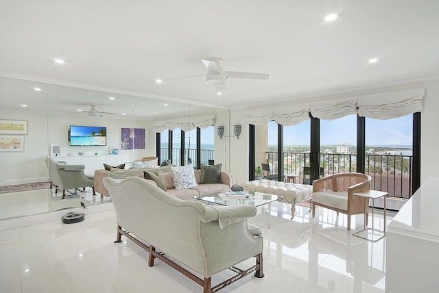 living area featuring ceiling fan, ornamental molding, plenty of natural light, and recessed lighting
