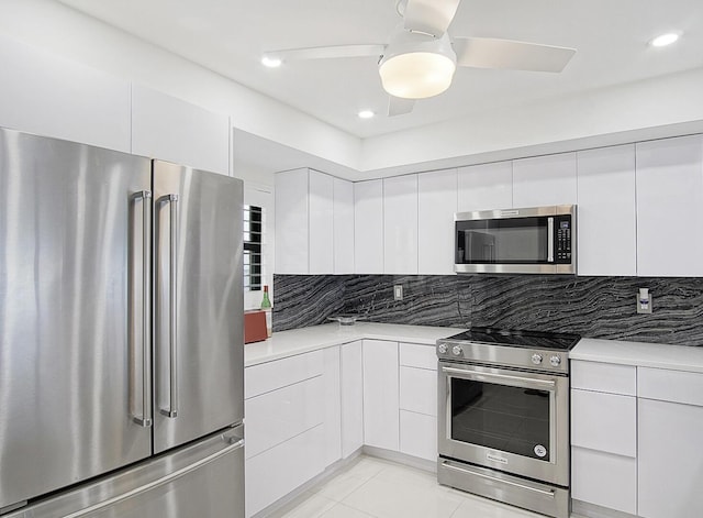 kitchen featuring modern cabinets, light countertops, and stainless steel appliances
