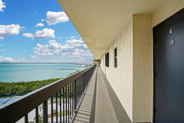 balcony featuring a water view
