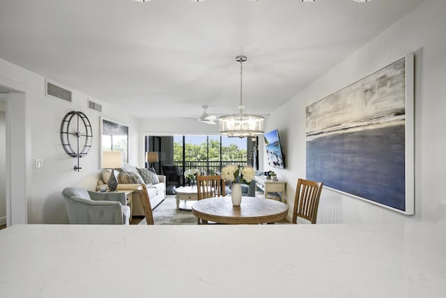 dining room featuring visible vents and an inviting chandelier