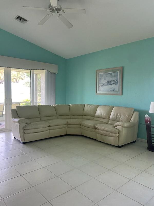 8047 Brindisi Ln, Boynton Beach, FL 33472 - living room featuring lofted ceiling, light tile patterned floors, and ceiling fan