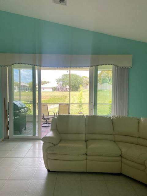 8047 Brindisi Ln, Boynton Beach, FL 33472 - living area with lofted ceiling and light tile patterned flooring