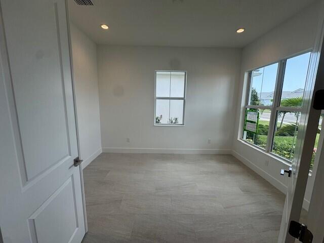 10009 Driftwood Way, Palm Beach Gardens, FL 33412 - unfurnished room featuring baseboards and recessed lighting