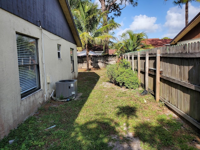 view of yard featuring a fenced backyard and cooling unit
