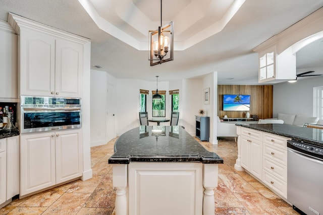420 SW 128th Ave, Miami, FL 33184 - kitchen with white cabinets, dark stone counters, stainless steel appliances, a tray ceiling, and an inviting chandelier