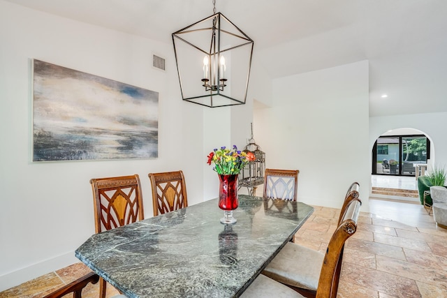 420 SW 128th Ave, Miami, FL 33184 - dining room featuring stone tile floors, recessed lighting, arched walkways, visible vents, and a notable chandelier