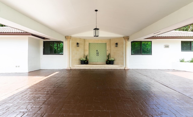420 SW 128th Ave, Miami, FL 33184 - view of exterior entry with stucco siding, a tile roof, and a patio