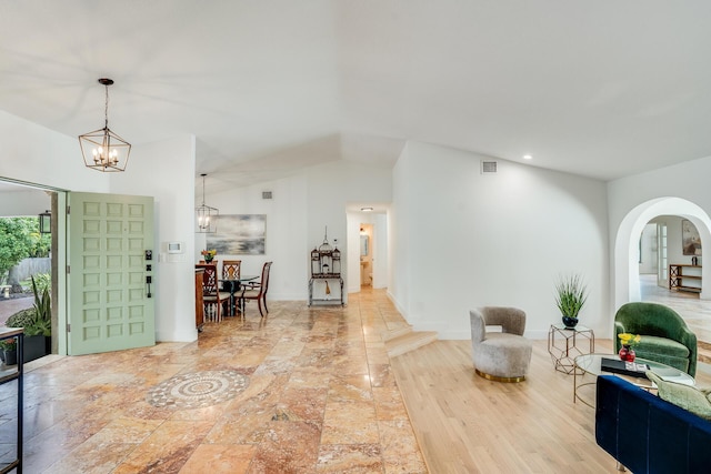 420 SW 128th Ave, Miami, FL 33184 - entryway featuring lofted ceiling, an inviting chandelier, baseboards, arched walkways, and visible vents