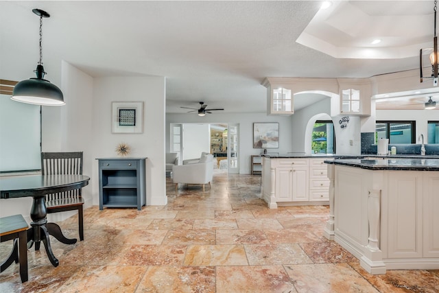 420 SW 128th Ave, Miami, FL 33184 - kitchen with hanging light fixtures, a peninsula, and a ceiling fan