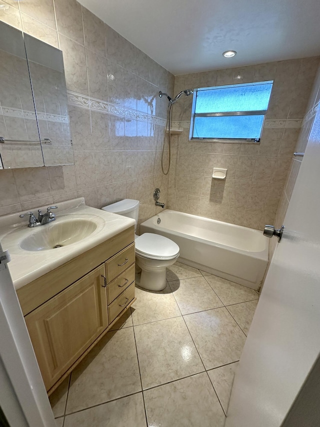 full bath featuring vanity, shower / tub combination, tile walls, toilet, and tile patterned floors
