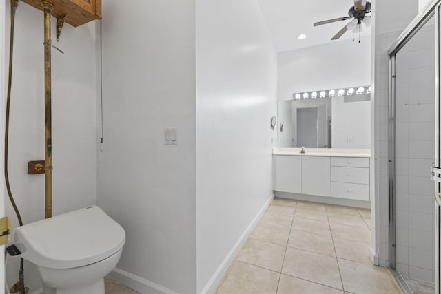 full bath with tile patterned flooring, vanity, baseboards, a stall shower, and a ceiling fan