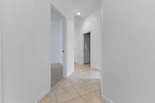 hall featuring recessed lighting, light tile patterned flooring, visible vents, and baseboards