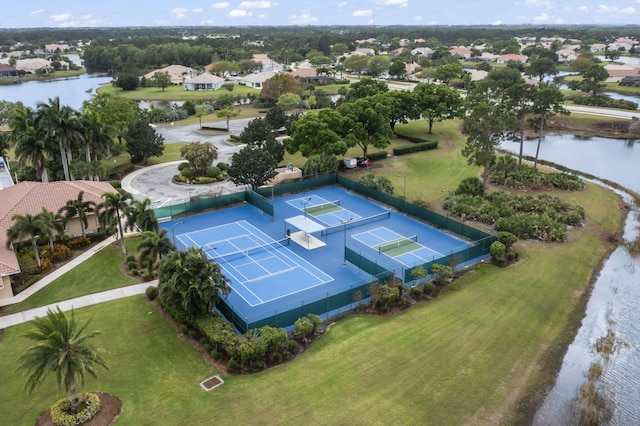 drone / aerial view featuring a water view and a residential view