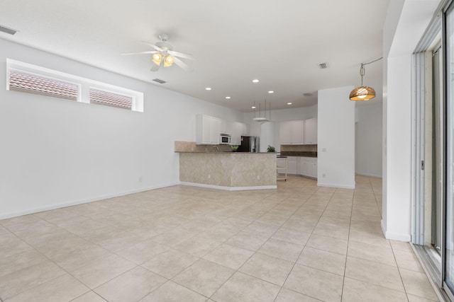 unfurnished living room with visible vents, recessed lighting, light tile patterned floors, and a ceiling fan