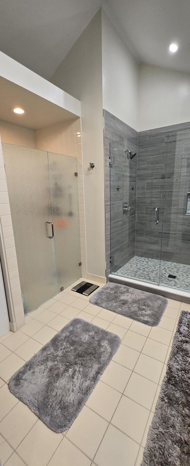 2285 Saratoga Ln, West Palm Beach, FL 33409 - full bath featuring recessed lighting, tile patterned floors, vaulted ceiling, and a stall shower