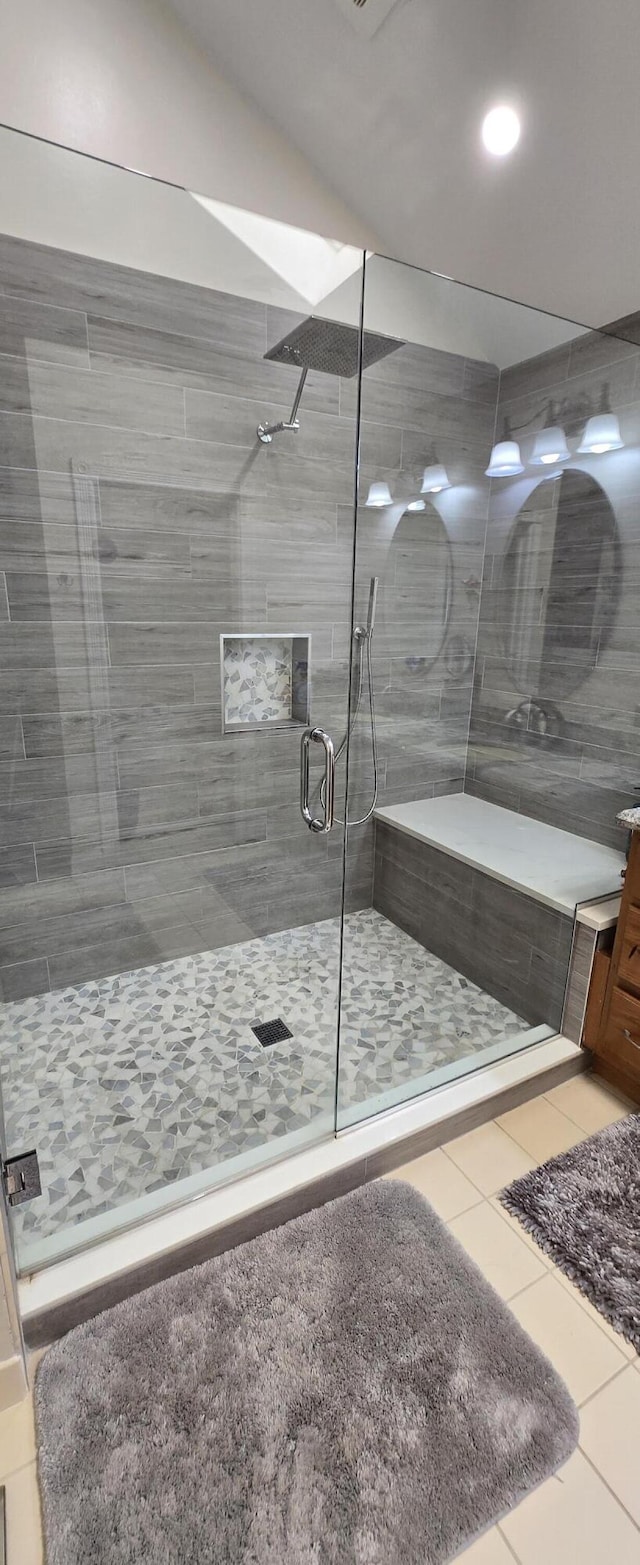 2285 Saratoga Ln, West Palm Beach, FL 33409 - bathroom featuring tile patterned flooring, a stall shower, and vanity