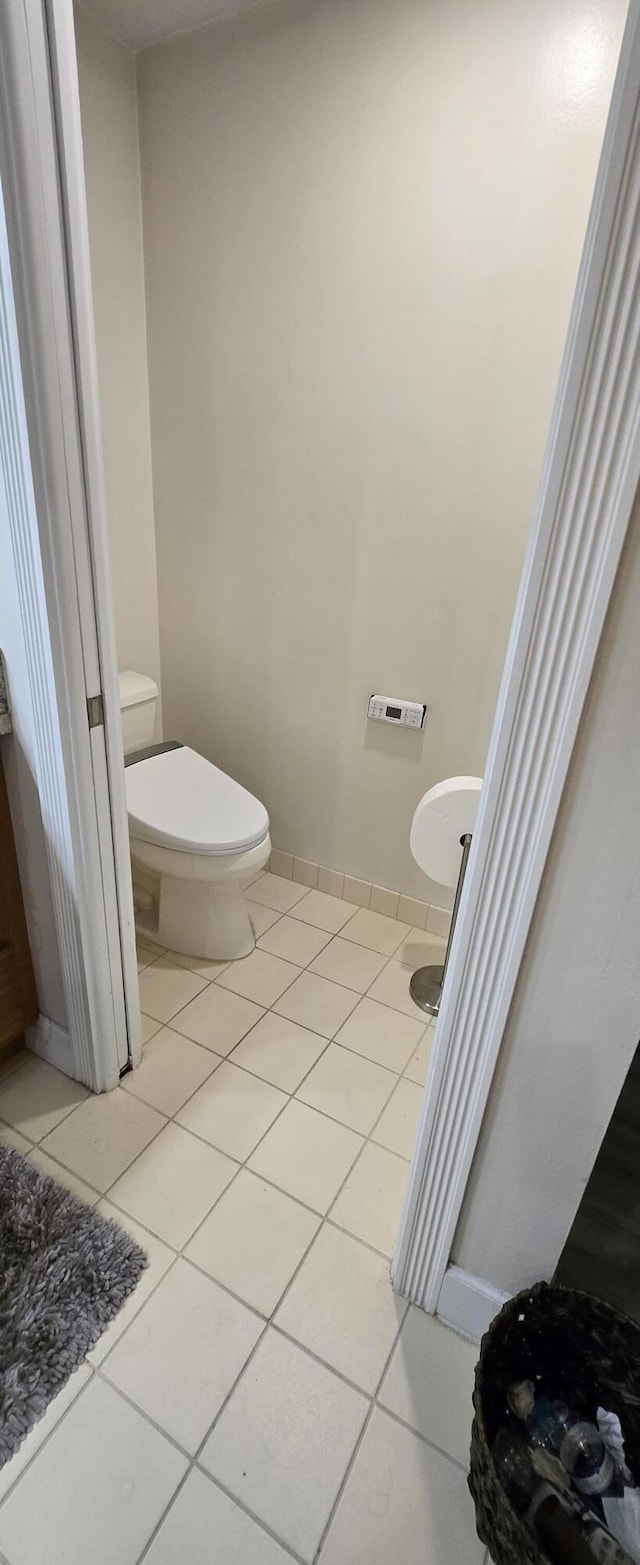 2285 Saratoga Ln, West Palm Beach, FL 33409 - bathroom featuring toilet and tile patterned floors