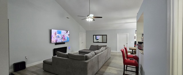 2285 Saratoga Ln, West Palm Beach, FL 33409 - living room featuring baseboards, a ceiling fan, visible vents, high vaulted ceiling, and wood finished floors