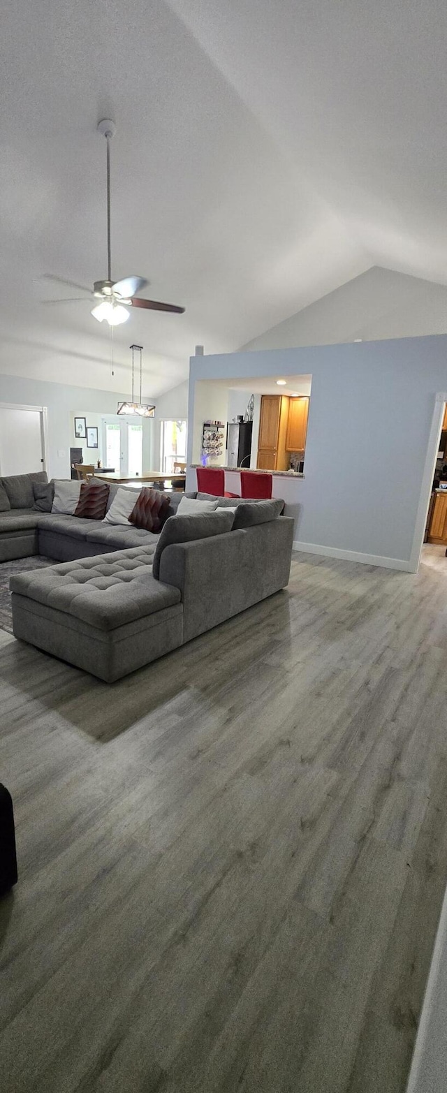 2285 Saratoga Ln, West Palm Beach, FL 33409 - living area featuring ceiling fan, baseboards, and lofted ceiling