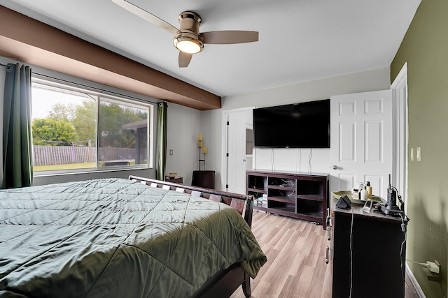 bedroom with a ceiling fan and light wood-type flooring