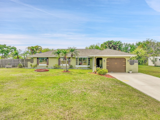 ranch-style home featuring fence, a garage, concrete driveway, a front lawn, and stucco siding