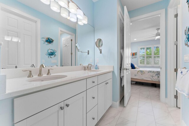21039 SW Modena Way, Port Saint Lucie, FL 34986 - bathroom with a shower stall, double vanity, a walk in closet, and a sink
