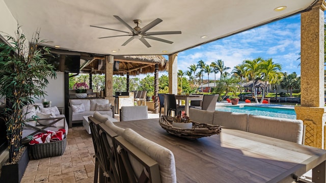 1526 SE 11th St, Deerfield Beach, FL 33441 - view of patio / terrace featuring ceiling fan, an outdoor hangout area, outdoor dining space, and an outdoor pool