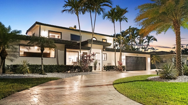 1526 SE 11th St, Deerfield Beach, FL 33441 - view of front of house with driveway, stucco siding, and an attached garage