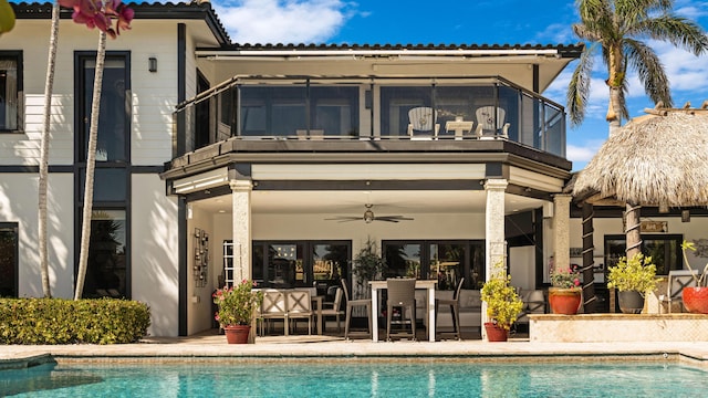 1526 SE 11th St, Deerfield Beach, FL 33441 - back of house featuring ceiling fan, a balcony, and an outdoor pool