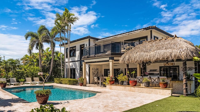 1526 SE 11th St, Deerfield Beach, FL 33441 - rear view of property with ceiling fan, a patio area, a balcony, and stucco siding