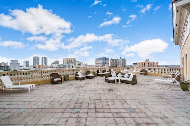 view of patio / terrace with outdoor lounge area and a view of city