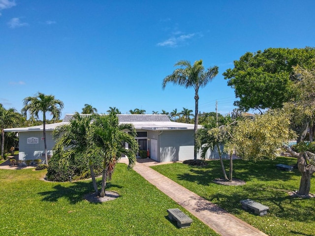 95 N N Blvd Unit 2B, Boynton Beach, FL 33435 - view of front of property with stucco siding and a front lawn