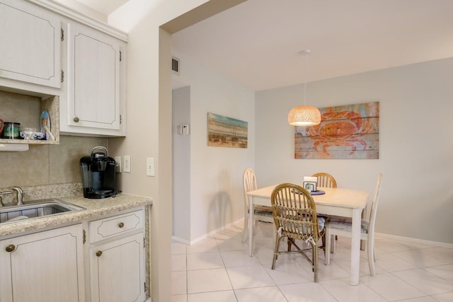 95 N N Blvd Unit 2B, Boynton Beach, FL 33435 - dining room featuring baseboards, visible vents, and light tile patterned floors