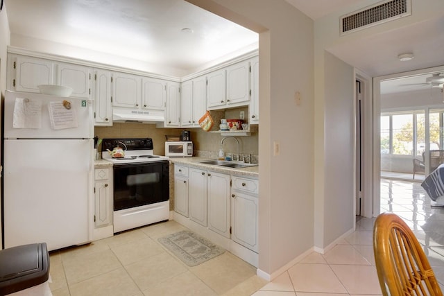 95 N N Blvd Unit 2B, Boynton Beach, FL 33435 - kitchen featuring visible vents, white appliances, under cabinet range hood, a sink, and light tile patterned floors