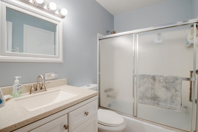 95 N N Blvd Unit 2B, Boynton Beach, FL 33435 - bathroom with combined bath / shower with glass door, toilet, and vanity