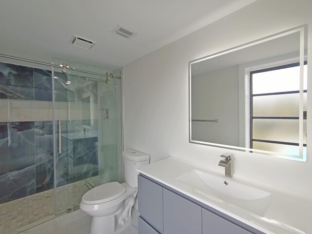 7240 Huntington Ln Unit 408, Delray Beach, FL 33446 - bathroom featuring toilet, vanity, and a stall shower