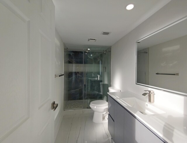 7240 Huntington Ln Unit 408, Delray Beach, FL 33446 - bathroom with marble finish floors, toilet, vanity, a marble finish shower, and recessed lighting